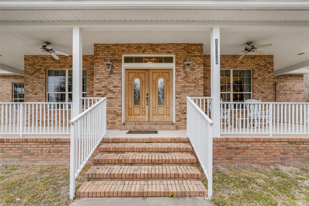 10336 Lake Louisa Road Clermont, FL 34711 - Photo 8 of 58 a view of a house with a porch