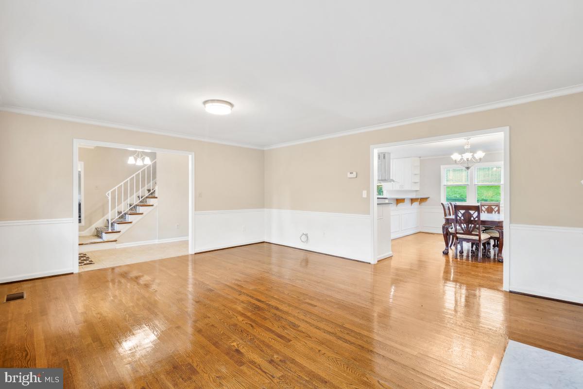 6871 Churchill Road McLean, VA 22101 - Photo 6 of 30 a view of an empty room with furniture and wooden floor