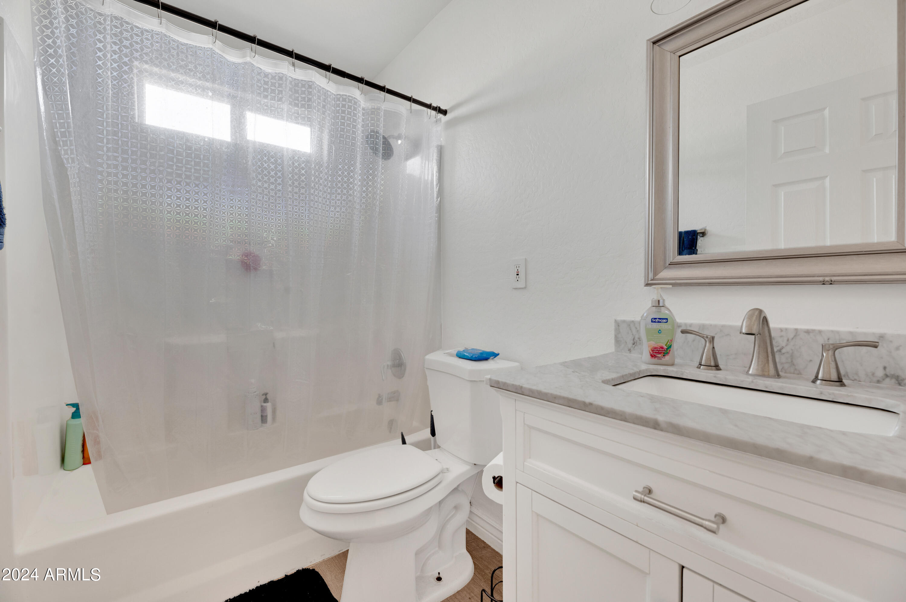 2702 East Juniper Avenue Phoenix, AZ 85032 - Photo 11 of 19 a bathroom with a sink a toilet and shower