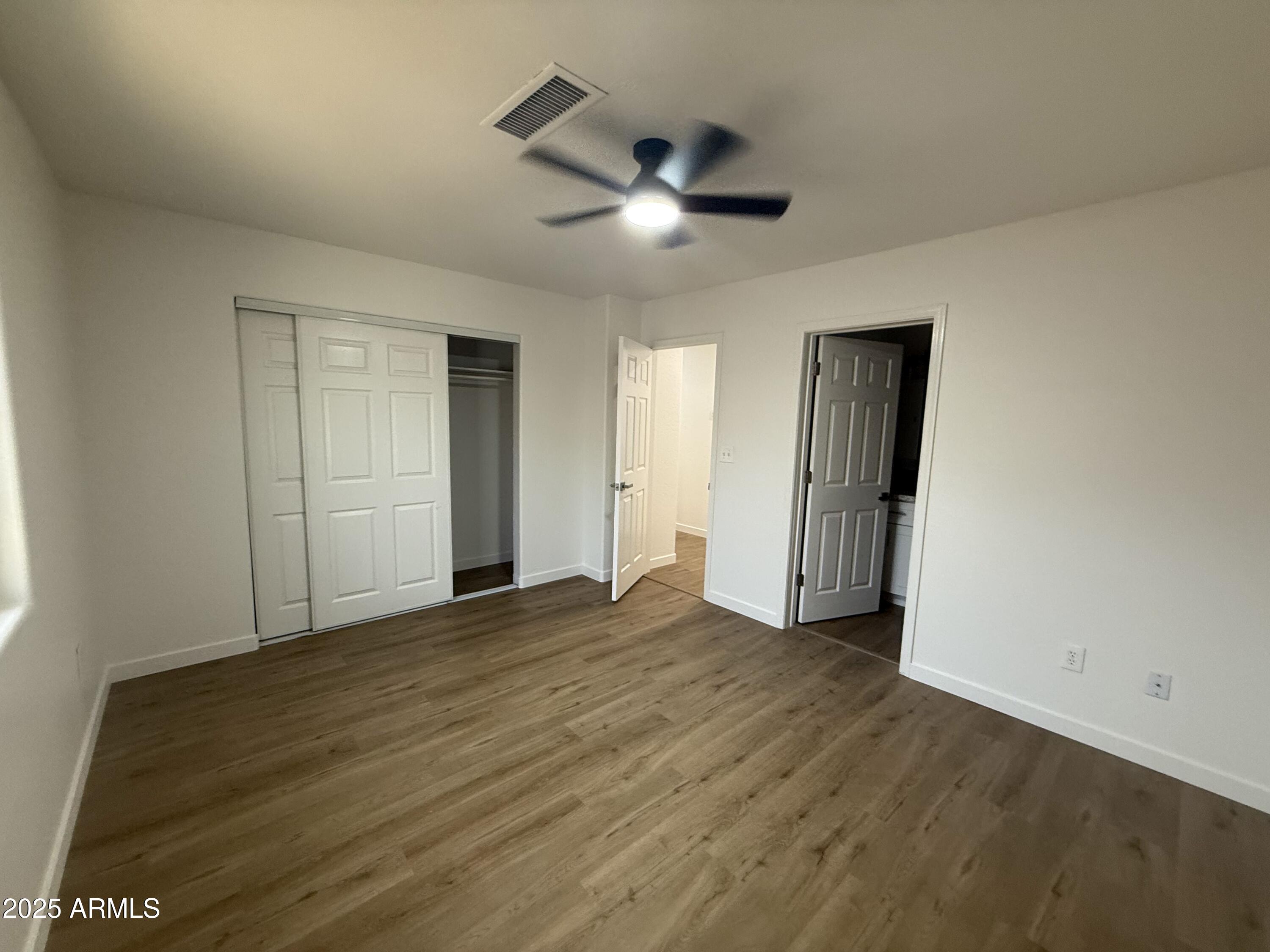 2702 East Juniper Avenue Phoenix, AZ 85032 - Photo 17 of 19 a view of empty room with wooden floor