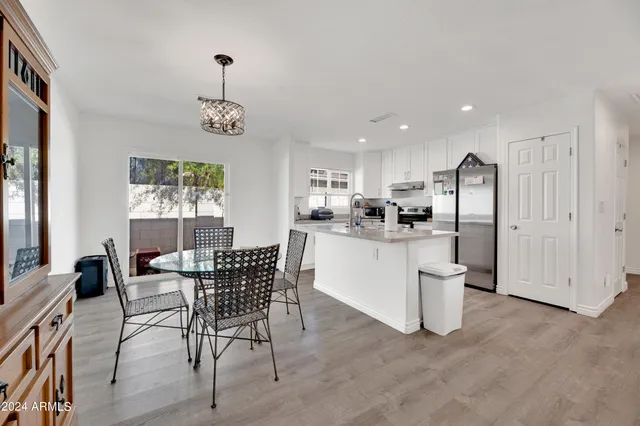 a dining room with furniture and window