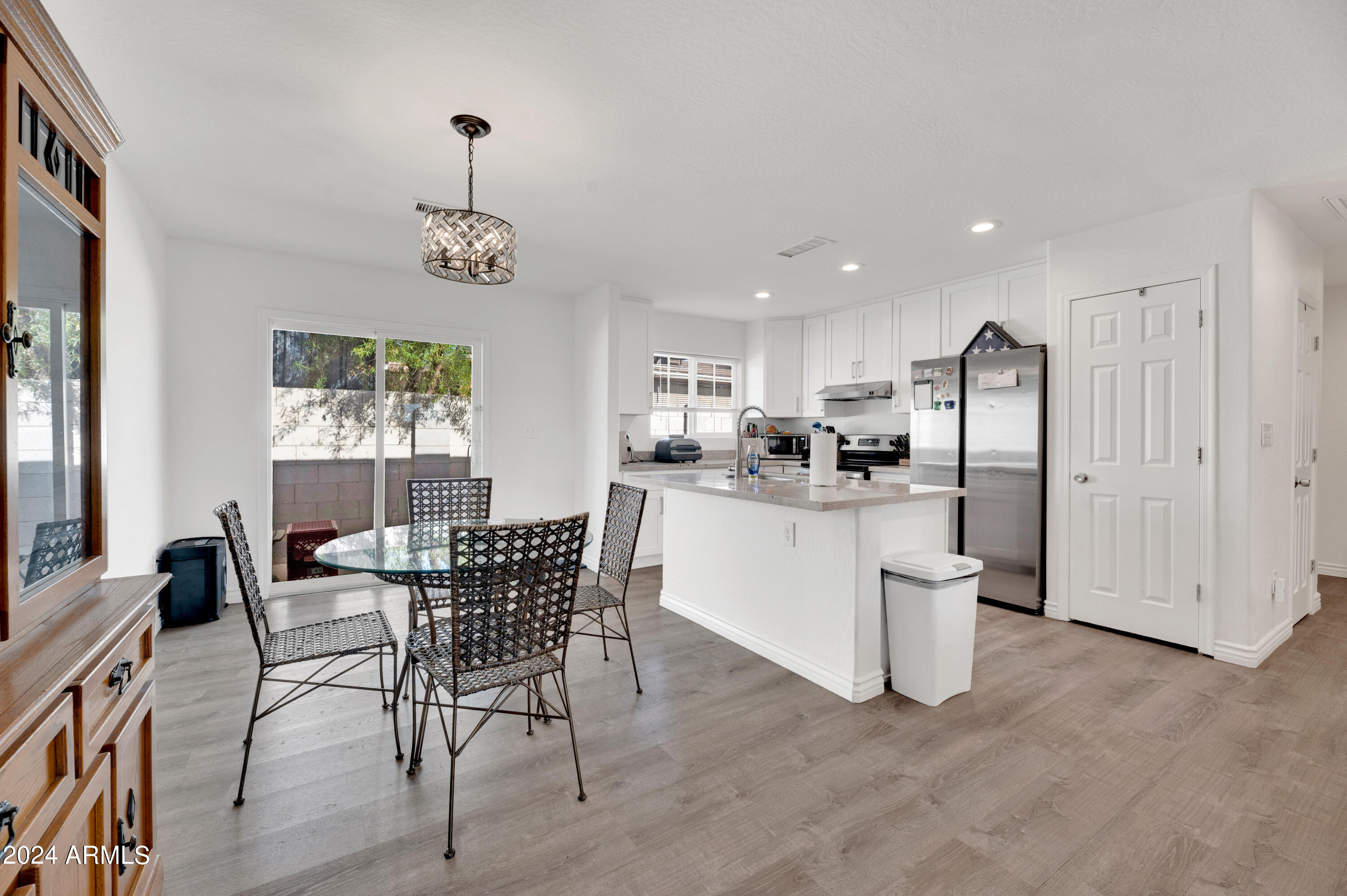 2702 East Juniper Avenue Phoenix, AZ 85032 - Photo 7 of 19 a dining room with furniture and window