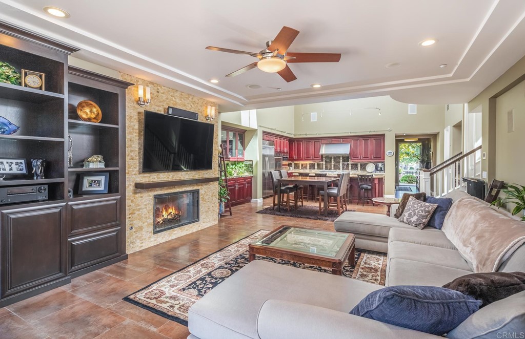 1905 Paxton Way Encinitas, CA 92024 - Photo 4 of 20 a living room with furniture a flat screen tv and a fireplace