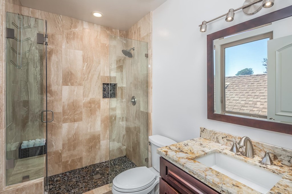 1905 Paxton Way Encinitas, CA 92024 - Photo 10 of 20 a bathroom with a sink toilet and shower