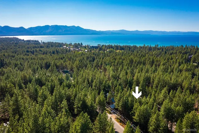 a view of a lush green hillside and a houses