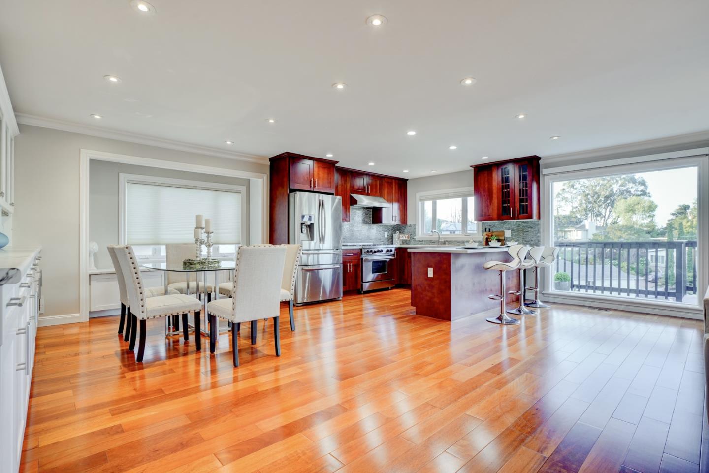 1112 Millbrae Avenue Millbrae, CA 94030 - Photo 18 of 100 a living room with furniture and kitchen view with wooden floor