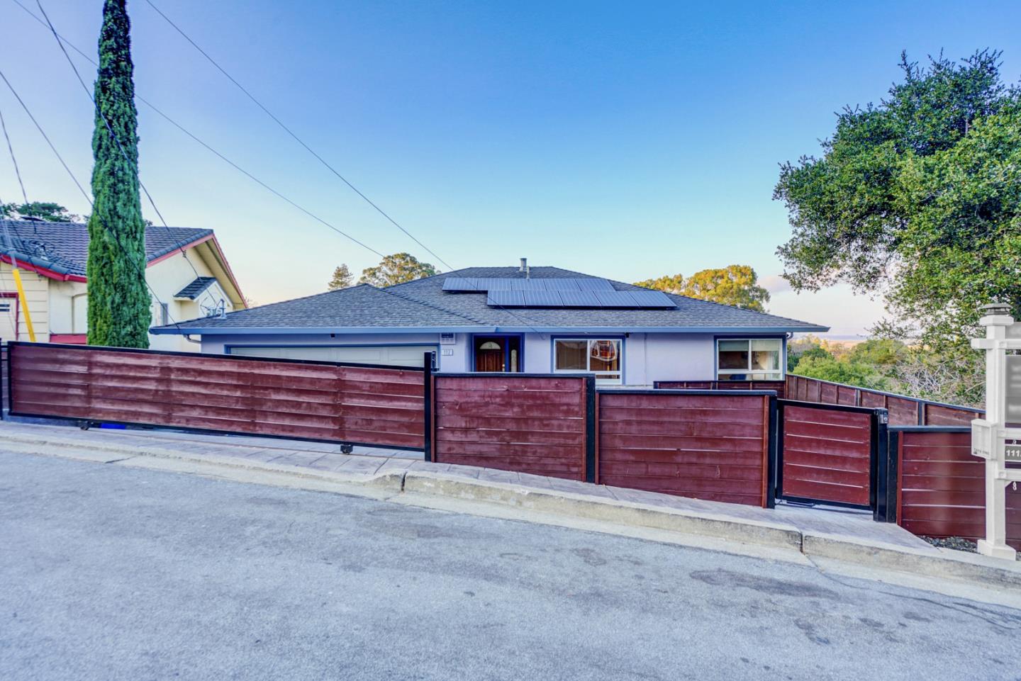 1112 Millbrae Avenue Millbrae, CA 94030 - Photo 2 of 100 a view of a house with a yard and garage