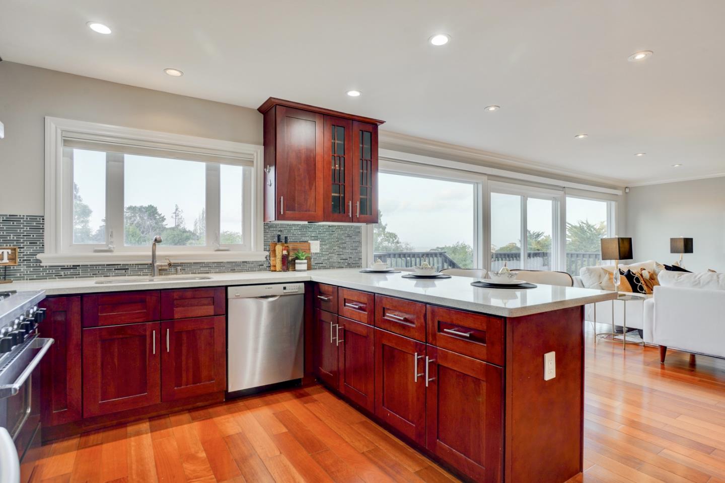 1112 Millbrae Avenue Millbrae, CA 94030 - Photo 24 of 100 a kitchen with a sink stove and wooden cabinets