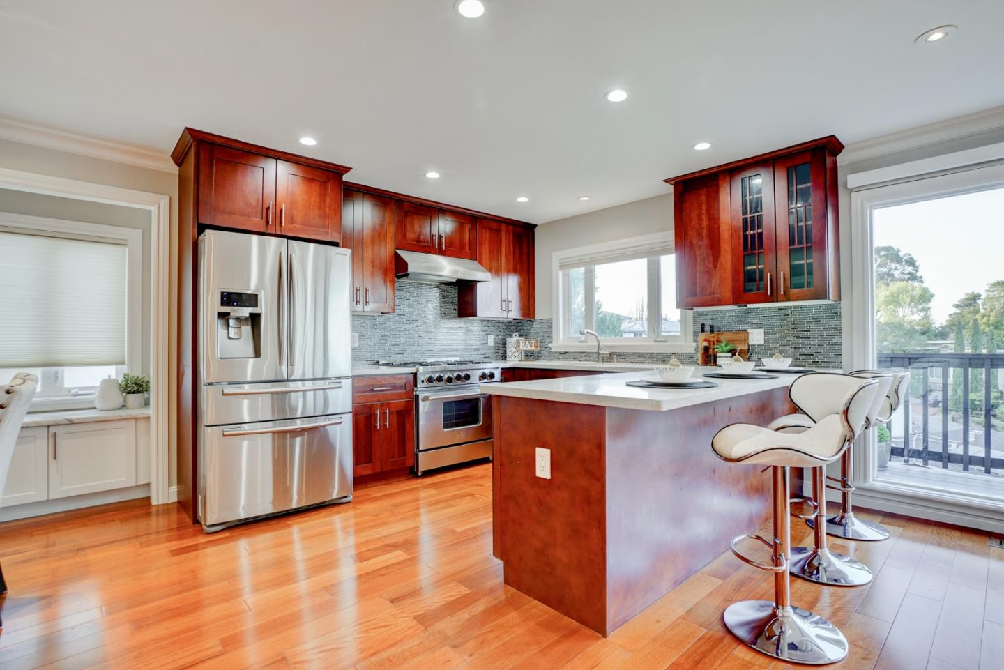 1112 Millbrae Avenue Millbrae, CA 94030 - Photo 25 of 100 a kitchen with stainless steel appliances granite countertop a refrigerator a stove and a sink with large window
