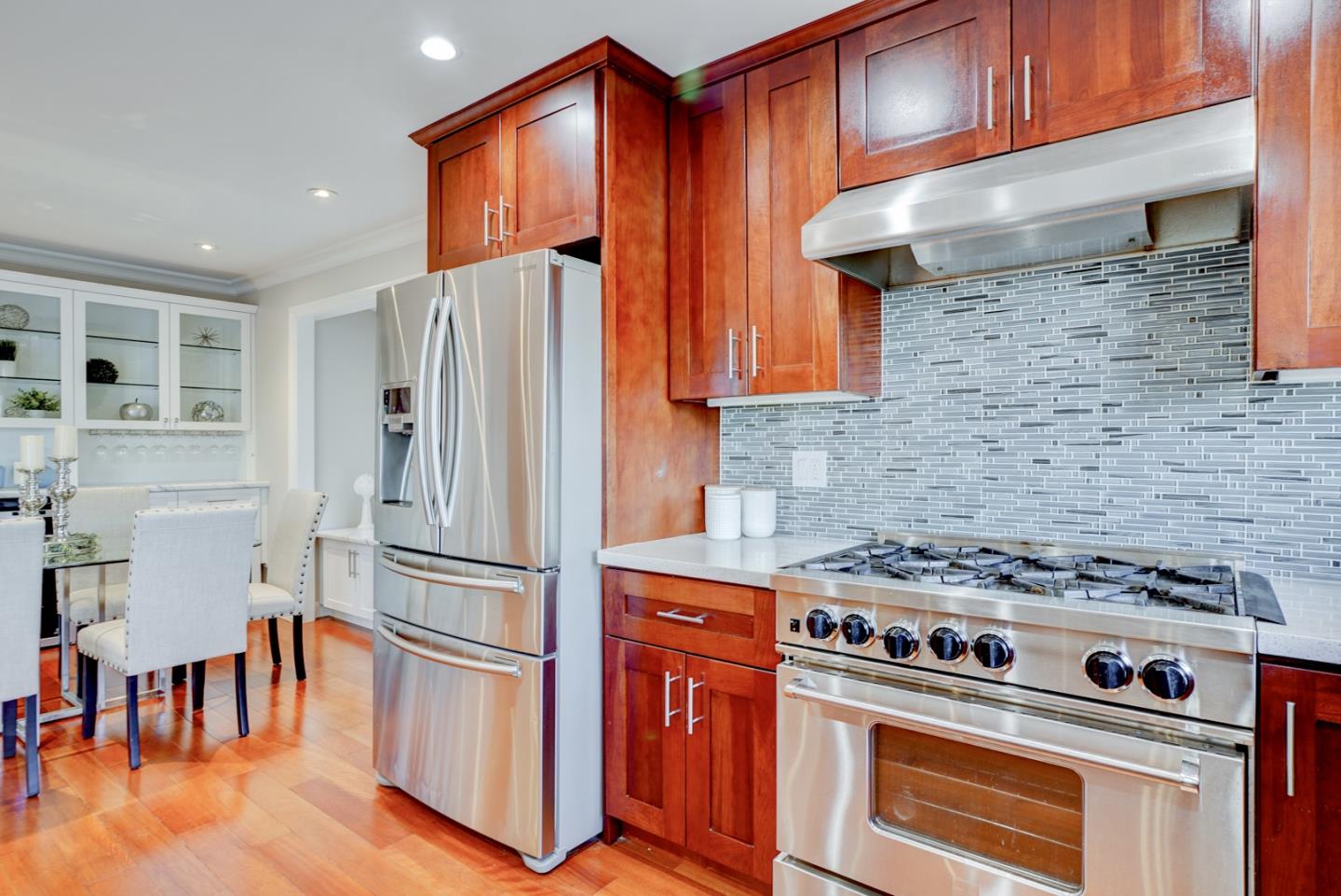 1112 Millbrae Avenue Millbrae, CA 94030 - Photo 27 of 100 a kitchen with stainless steel appliances granite countertop a stove and a refrigerator