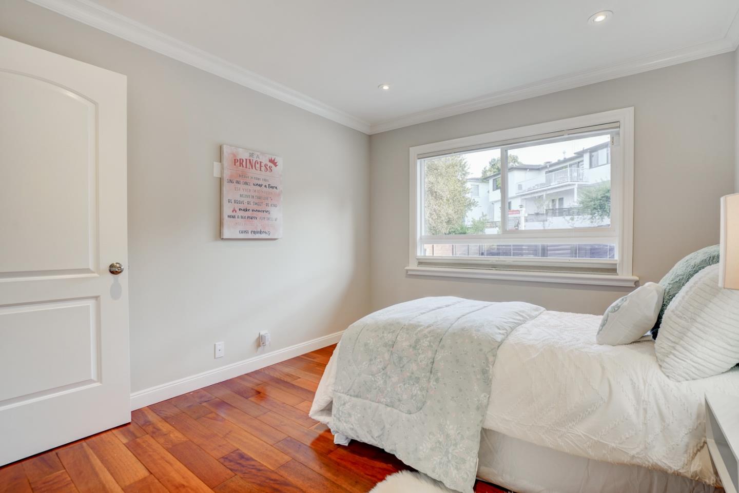 1112 Millbrae Avenue Millbrae, CA 94030 - Photo 30 of 100 a bedroom with a bed and a window