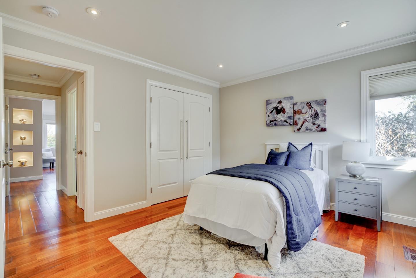 1112 Millbrae Avenue Millbrae, CA 94030 - Photo 34 of 100 a spacious bedroom with a bed and a window