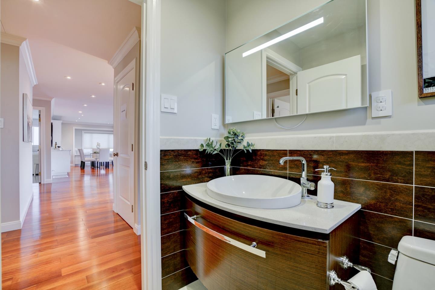 1112 Millbrae Avenue Millbrae, CA 94030 - Photo 36 of 100 a bathroom with a sink and a mirror