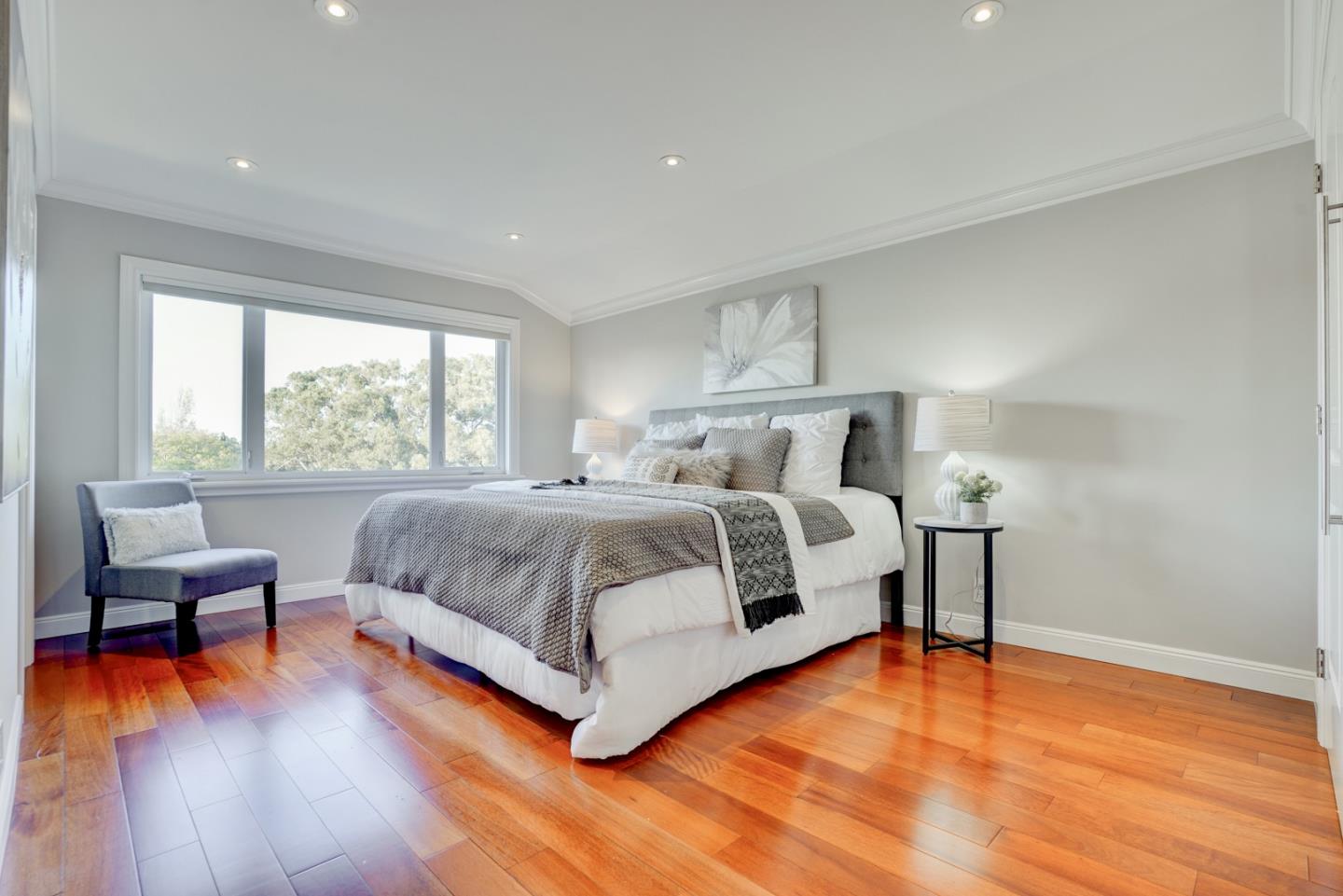1112 Millbrae Avenue Millbrae, CA 94030 - Photo 37 of 100 a bedroom with a bed and wooden floor
