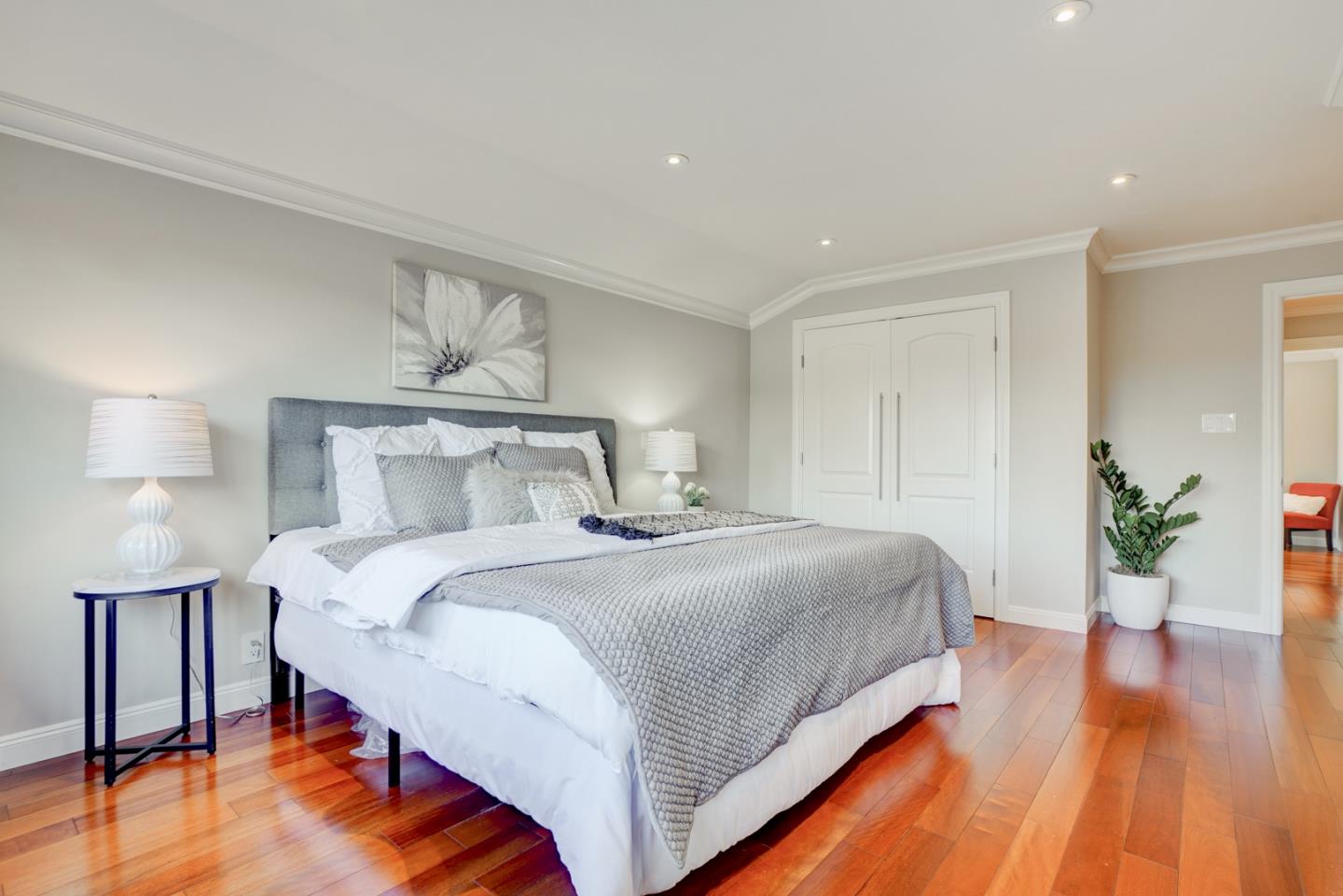 1112 Millbrae Avenue Millbrae, CA 94030 - Photo 39 of 100 a bedroom with a bed and wooden floor