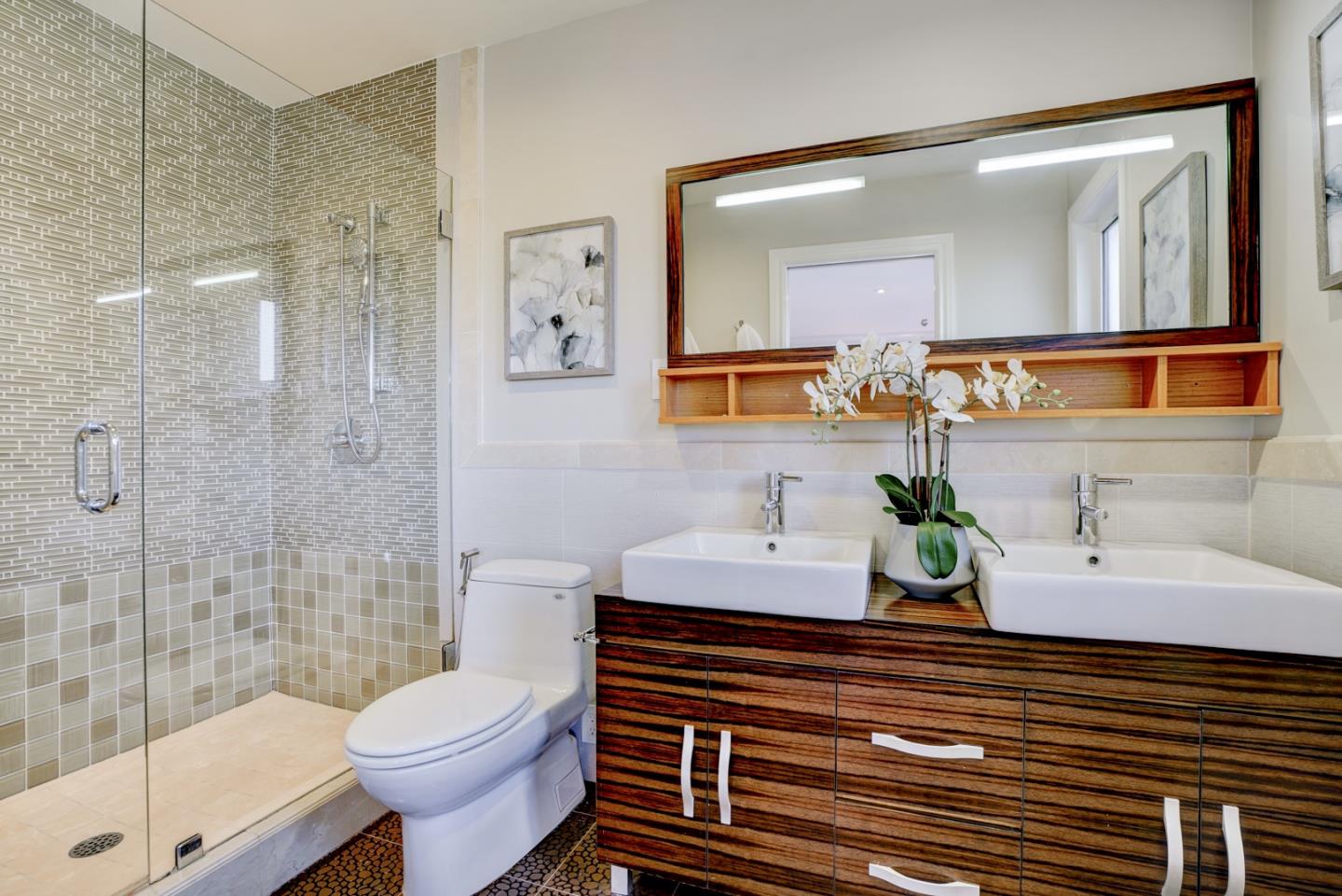 1112 Millbrae Avenue Millbrae, CA 94030 - Photo 40 of 100 a bathroom with a sink a toilet and shower