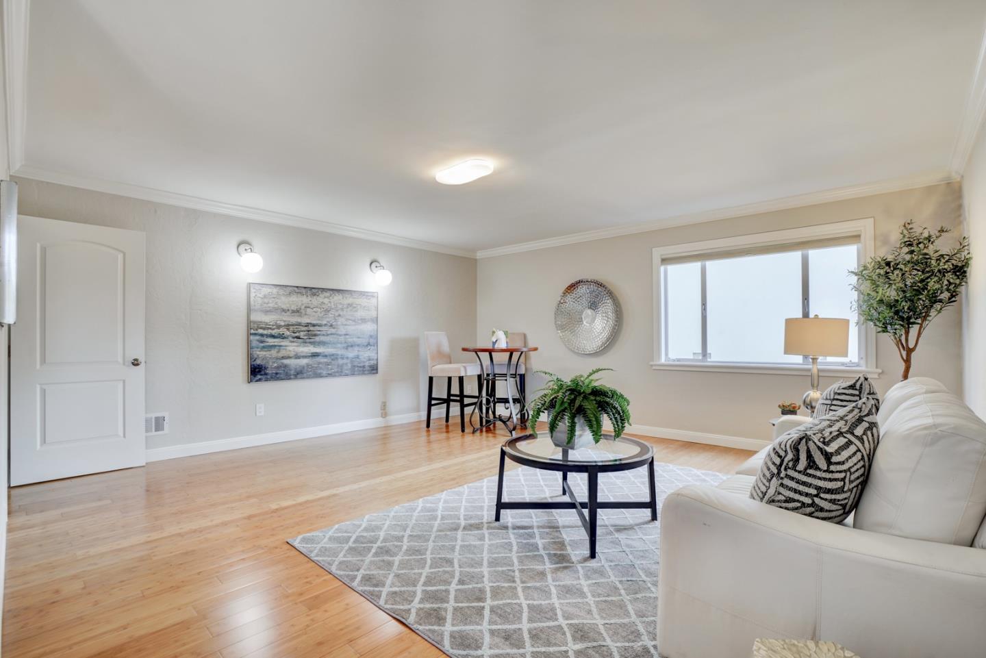 1112 Millbrae Avenue Millbrae, CA 94030 - Photo 47 of 100 a living room with furniture and a large window