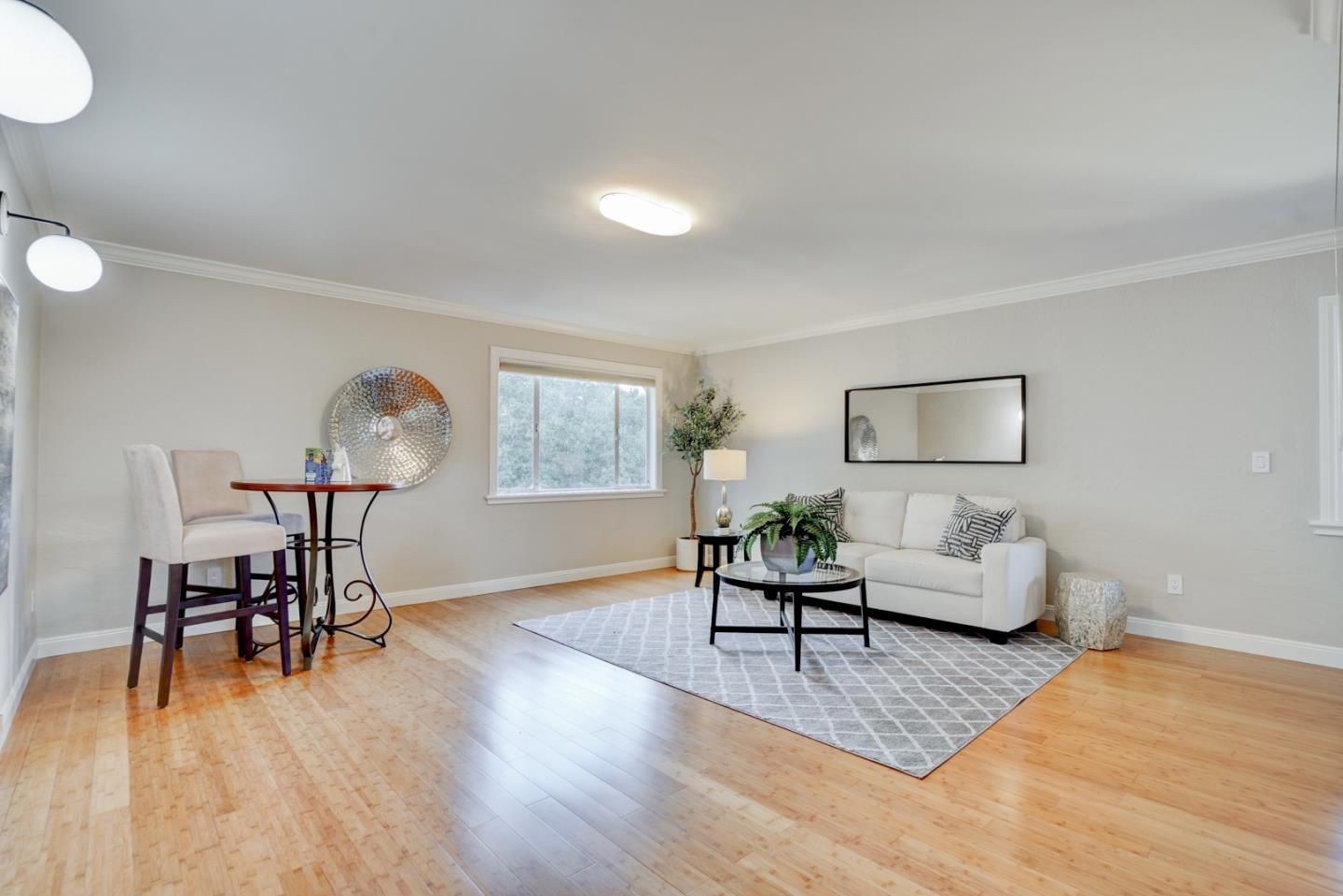1112 Millbrae Avenue Millbrae, CA 94030 - Photo 48 of 100 a living room with furniture and a wooden floor