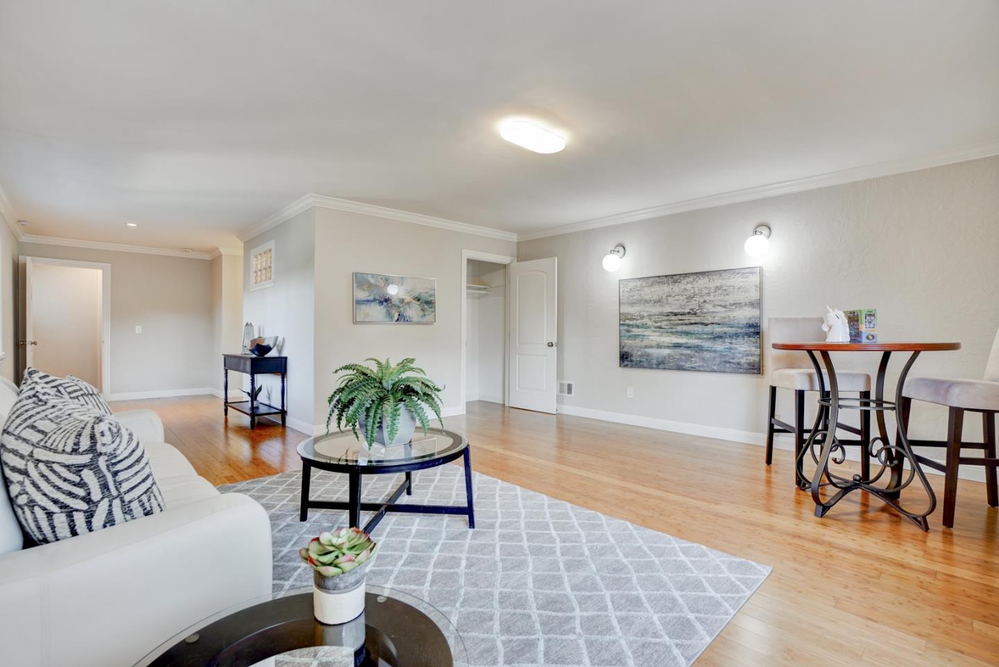 1112 Millbrae Avenue Millbrae, CA 94030 - Photo 50 of 100 a living room with furniture and wooden floor