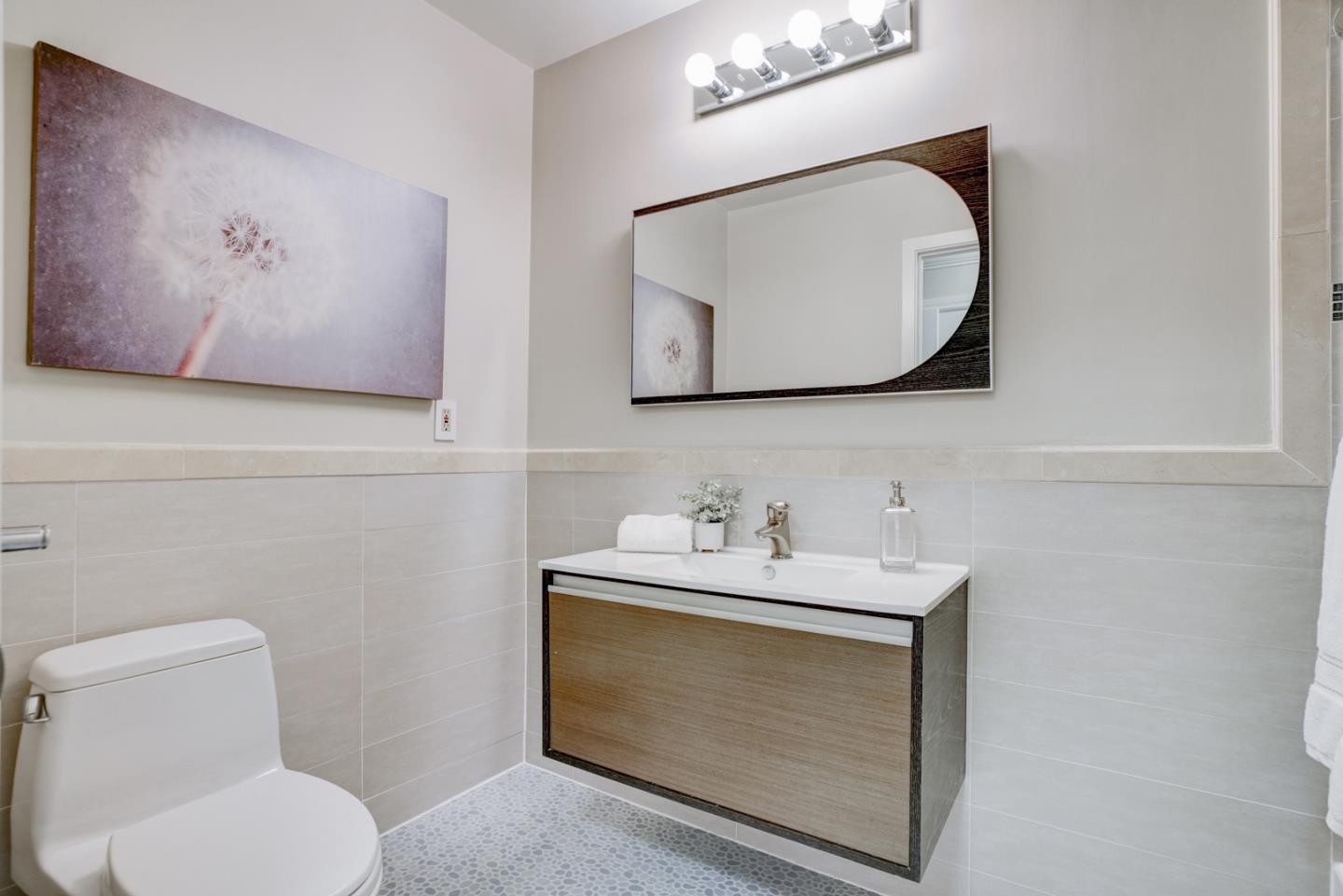 1112 Millbrae Avenue Millbrae, CA 94030 - Photo 51 of 100 a bathroom with a toilet sink and mirror
