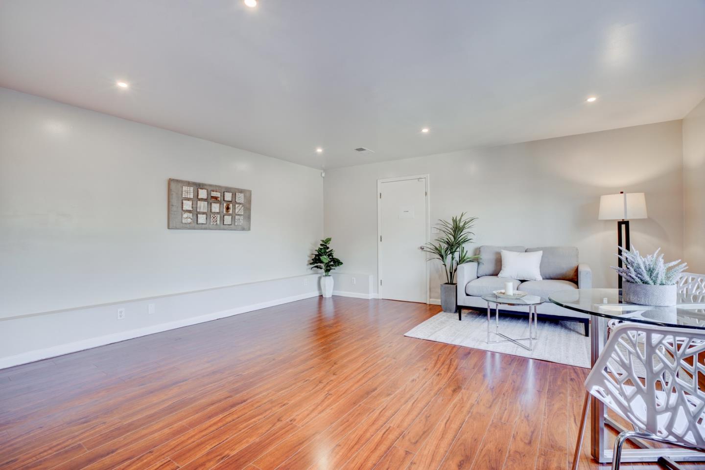 1112 Millbrae Avenue Millbrae, CA 94030 - Photo 68 of 100 a living room with furniture and a wooden floor