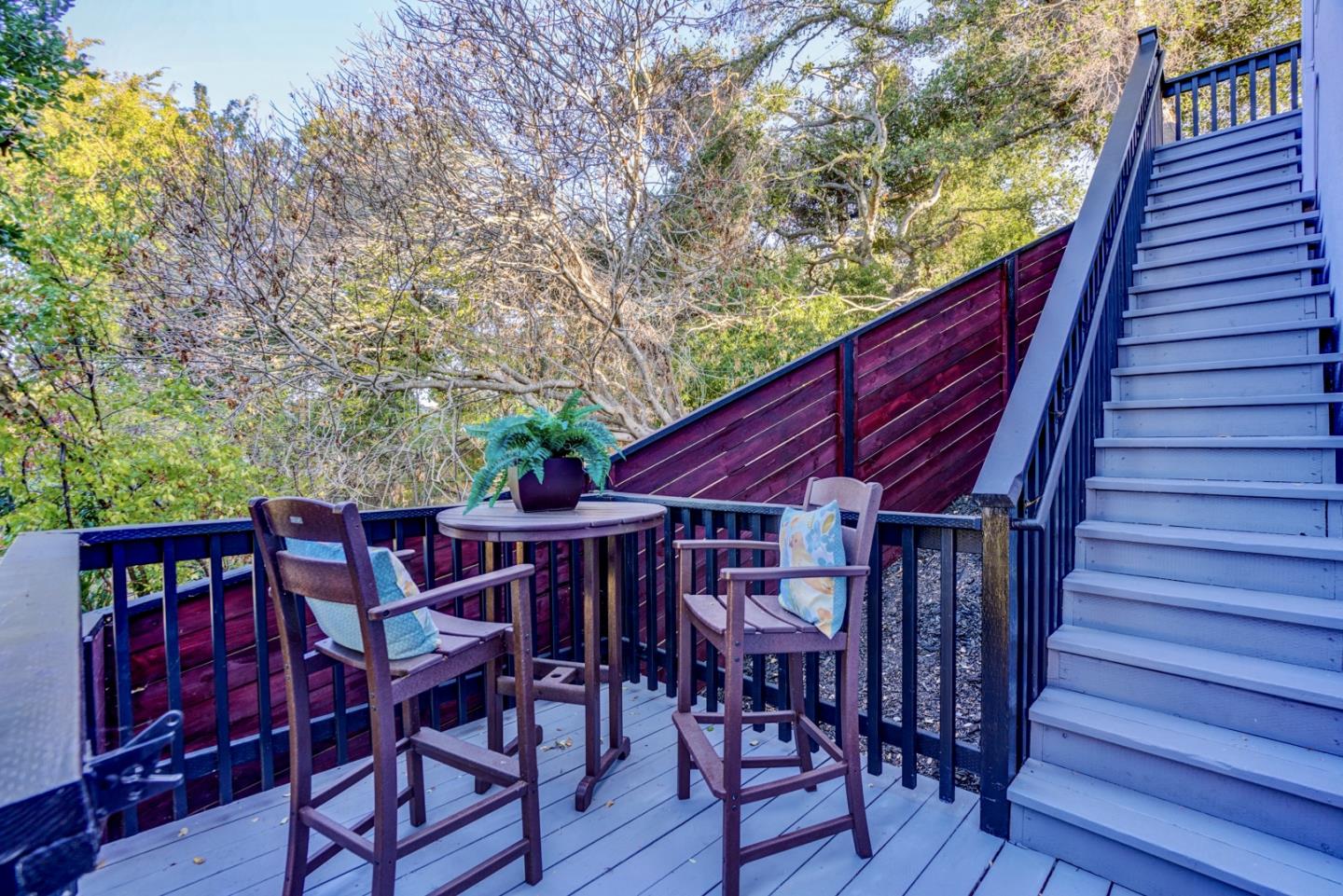 1112 Millbrae Avenue Millbrae, CA 94030 - Photo 97 of 100 a view of a patio with table and chairs with wooden floor and fence