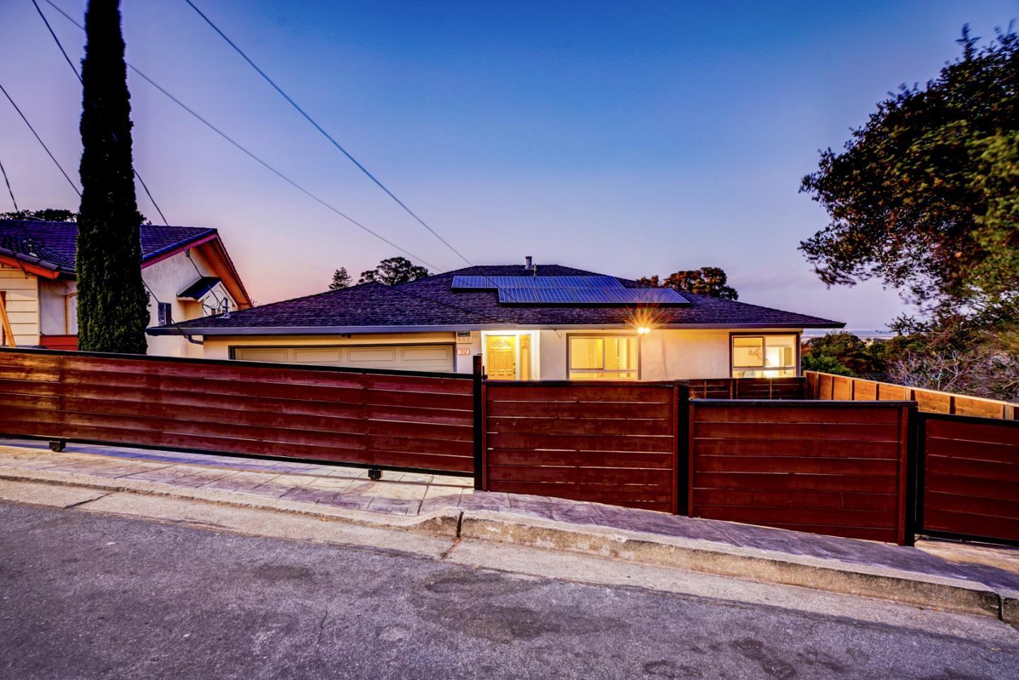 1112 Millbrae Avenue Millbrae, CA 94030 - Photo 99 of 100 a view of a house with a yard and wooden fence