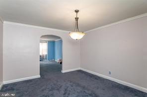 1618 Roundhill Road Baltimore, MD 21218 - Photo 12 of 50 wooden floor in an empty room with a window