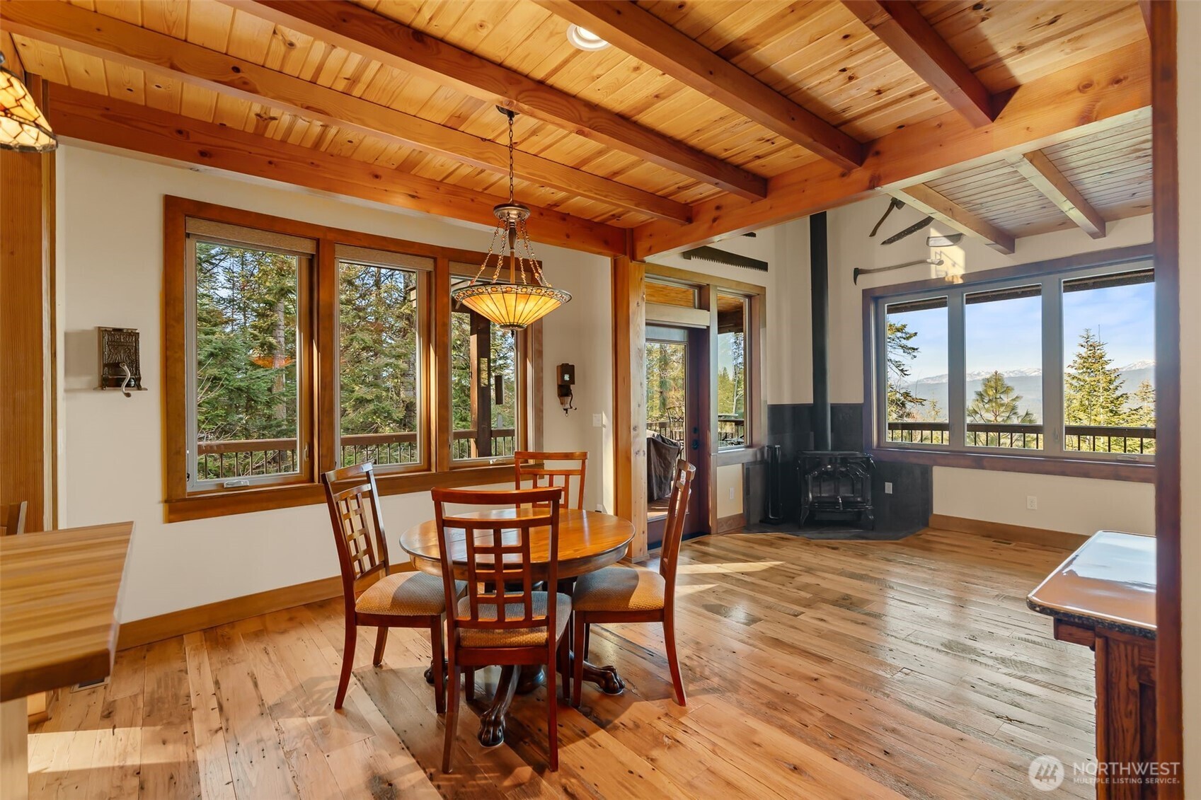 824 Huntrick Drive Cle Elum, WA 98922 - Photo 13 of 38 a dining room with furniture a chandelier and wooden floor