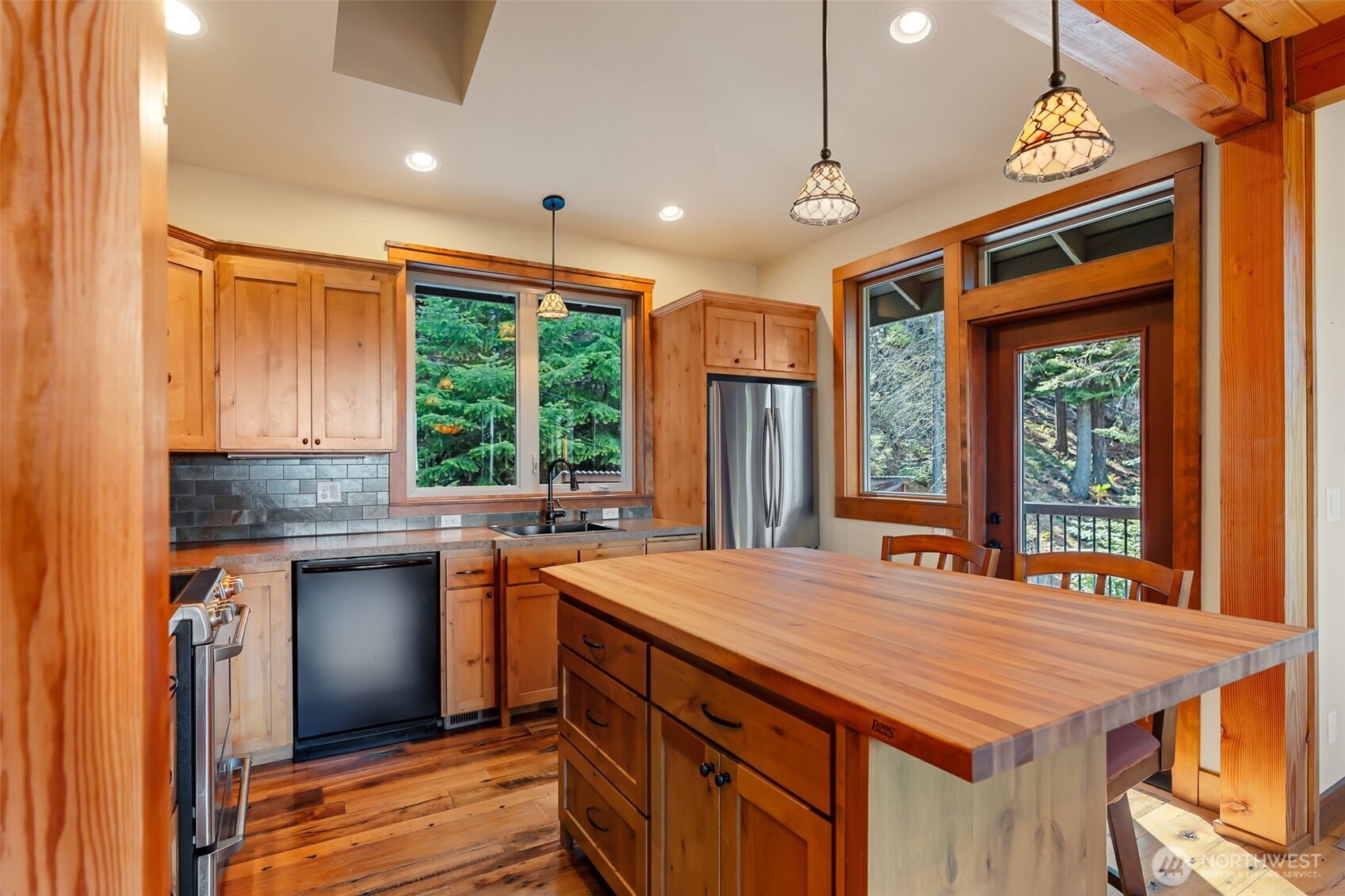 824 Huntrick Drive Cle Elum, WA 98922 - Photo 15 of 38 a kitchen with stainless steel appliances granite countertop a stove a sink and a refrigerator