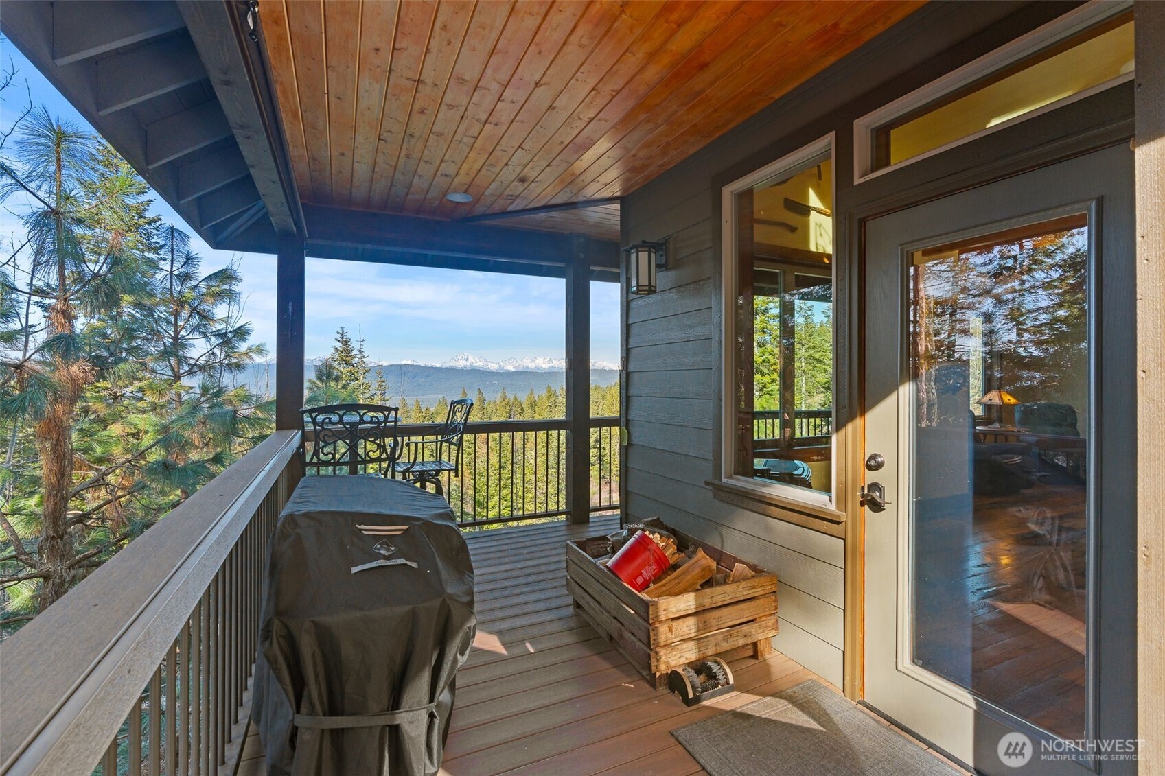 824 Huntrick Drive Cle Elum, WA 98922 - Photo 27 of 38 a balcony with wooden floor and outdoor seating