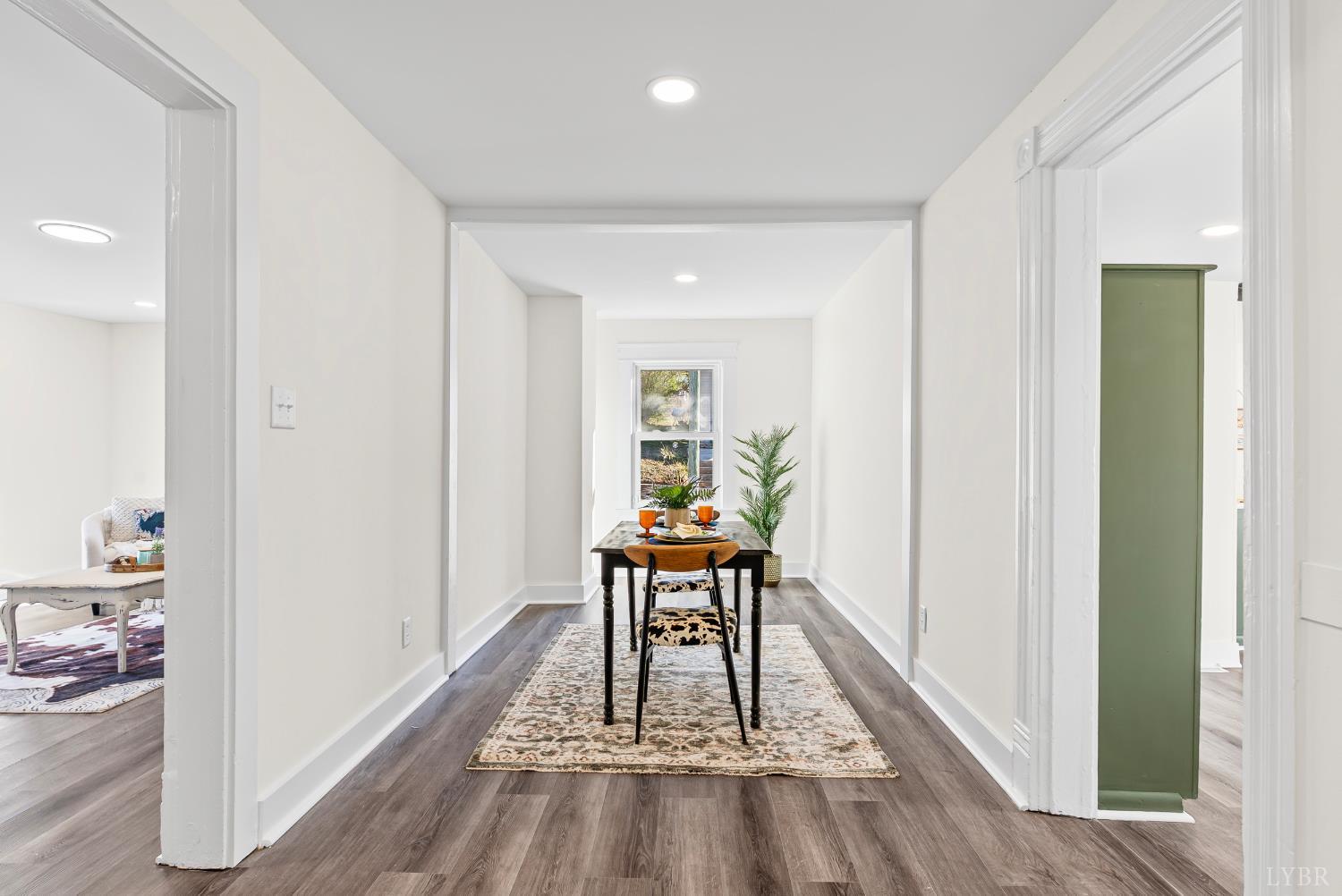 2961 Triangle Place Lynchburg, VA 24501 - Photo 10 of 26 a view of a hallway with wooden floor and a livingroom