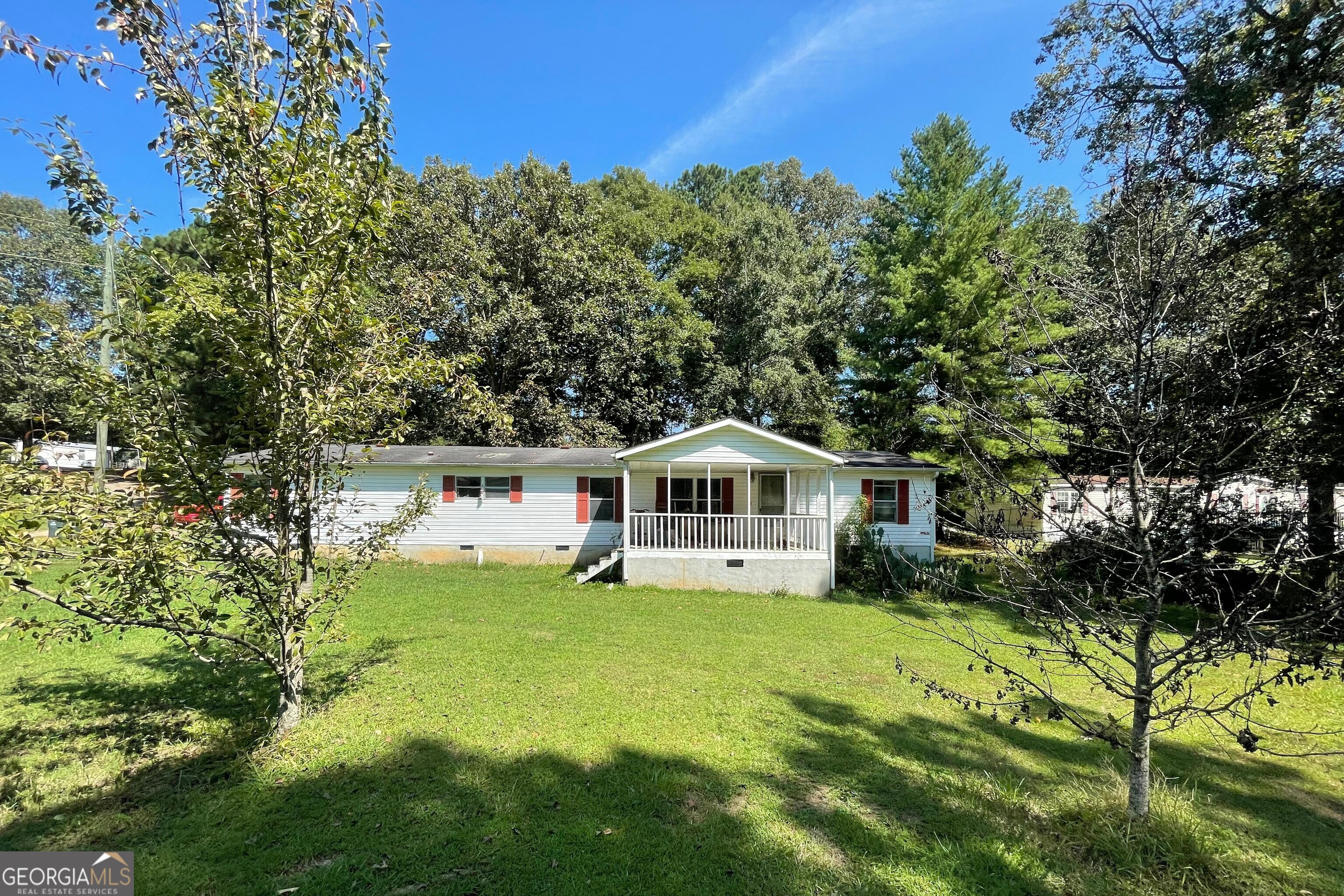 122 Fairmont Way Resaca, GA 30735 - Photo 1 of 1 a white house with a big yard plants and large trees