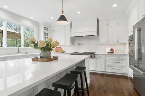 a kitchen with a table and chairs in it