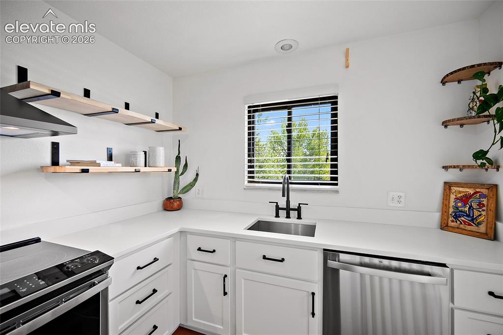 2979 Mesa Road, Unit D Colorado Springs, CO 80904 - Photo 14 of 40 Floating shelves give a look of elegance.