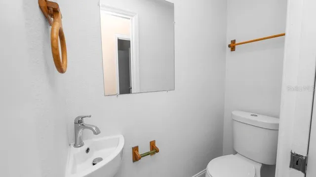 a bathroom with a toilet and a sink