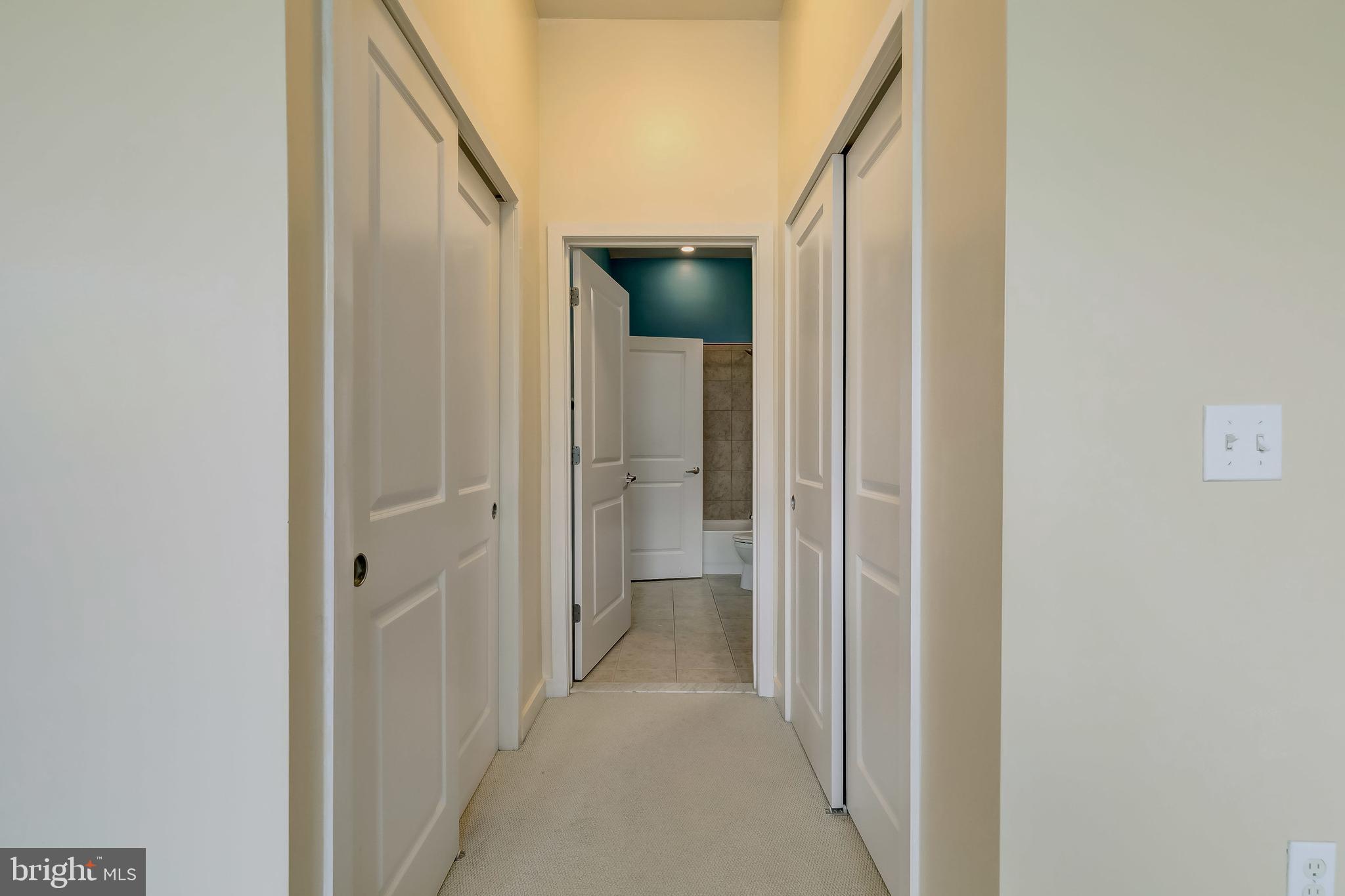 1209 North Charles Street, Unit 304 Baltimore, MD 21201 - Photo 20 of 37 a view of a hallway with wooden shelves