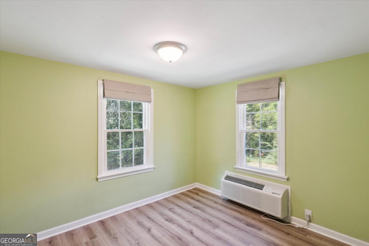 6326 N Highway Springfield, GA 31329 - Photo 8 of 14 a view of a room with wooden floor and windows