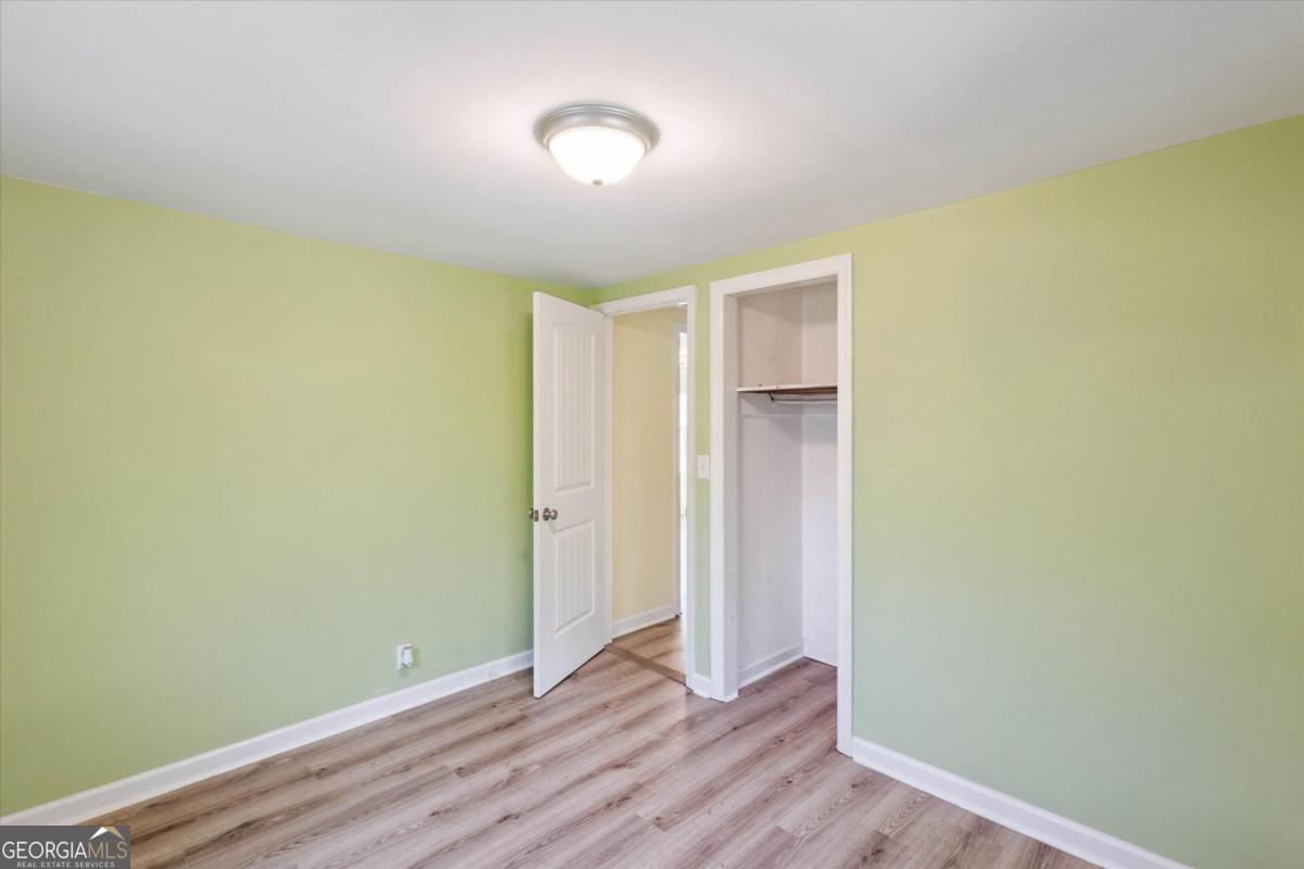 6326 N Highway Springfield, GA 31329 - Photo 9 of 14 a view of room with wooden floor