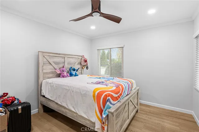 a bedroom with bed and a window