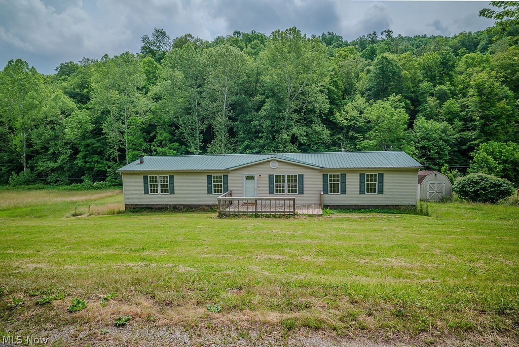 967 Buck Run Road Mineral Wells, WV 26150 - Photo 1 of 50 Ranch-style residence featuring a metal roof and light-colored siding