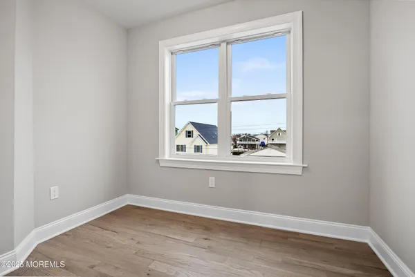 a view of wooden floor and a window