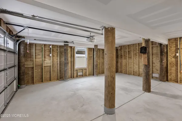 a view of a hallway with wooden walls