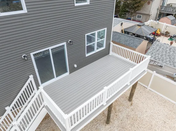 a view of a wooden deck and city view