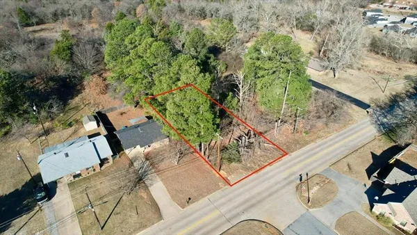 a backyard of a building with lots of trees