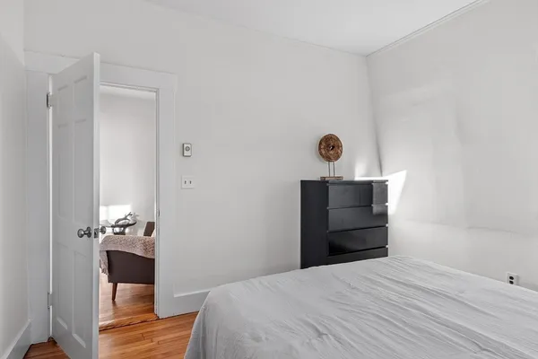 a bedroom with a bed and a cabinets
