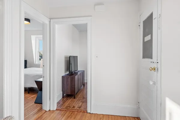 a view of a hallway with bathroom