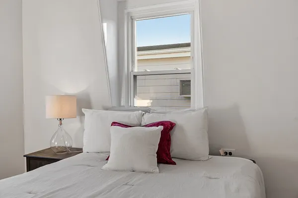 a very nice looking room with a chair and a window