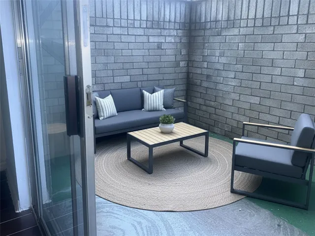 a living room with furniture and a rug