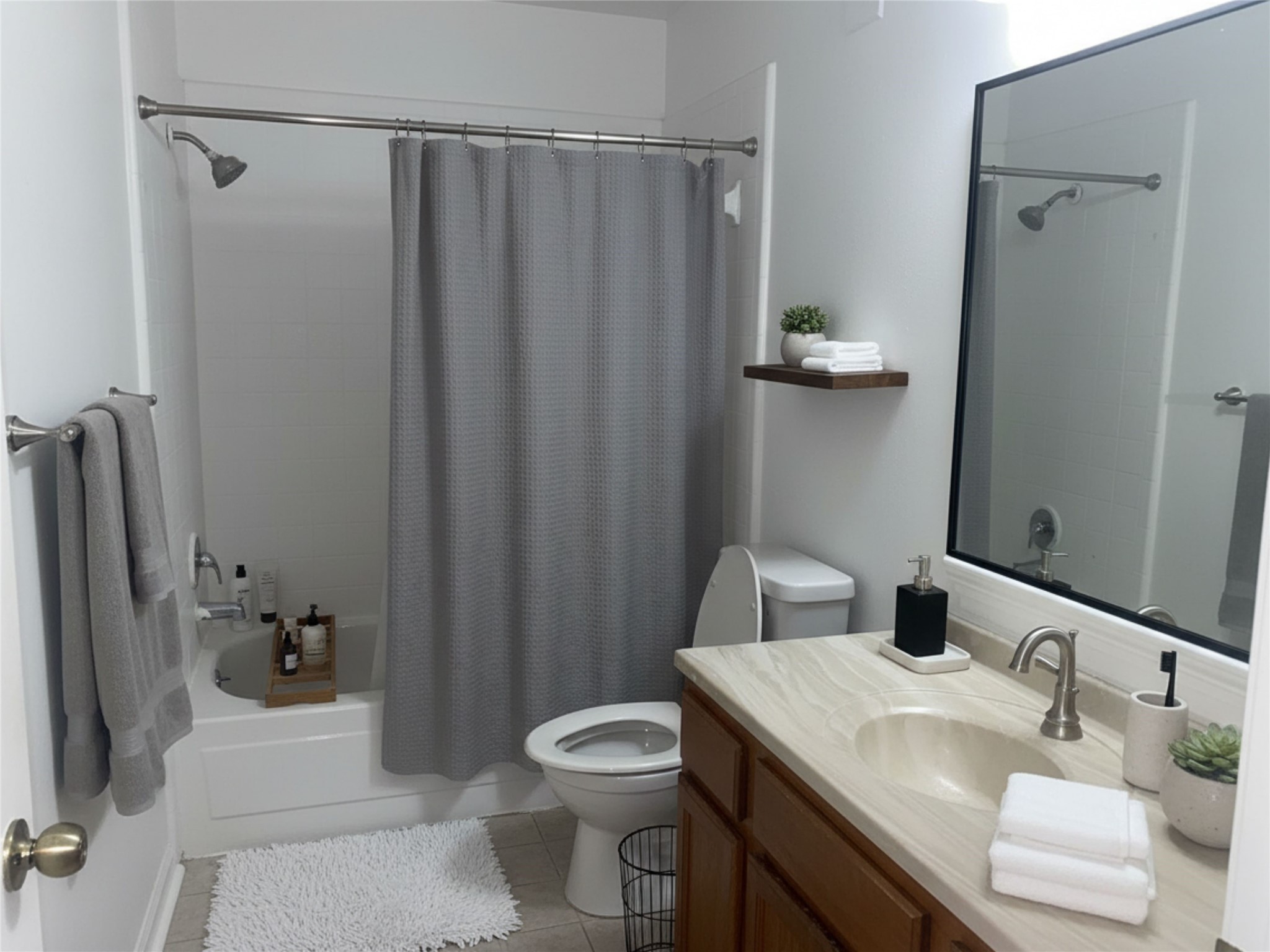 6500 Sands Point Drive, Unit 201 Houston, TX 77074 - Photo 4 of 10 a bathroom with a sink a toilet and shower